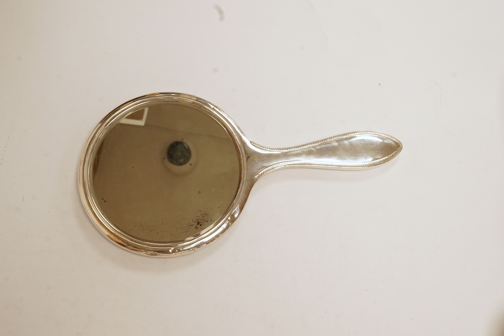 Six assorted silver lidded glass toilet jars including long rectangular, Birmingham, 1904, 22.9cm, together with a silver mounted hand mirror. Condition - poor